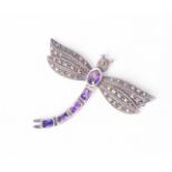 A marked 925 white metal dragonfly patterned brooch, set with amethysts and marcasite