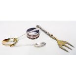 Two small silver spoons, napkin ring and a silver handled muffin fork