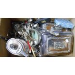 A box containing a pair of silver plated entree dishes with detachable handles, loose cutlery,