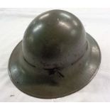 A Second World War firewatcher's tin helmet