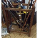 An early 20th Century stained oak umbrella/stick stand with metal drip tray to base