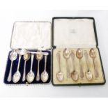 A cased set of six silver ornate teaspoons - sold with a case containing seven harlequin silver golf