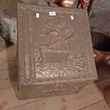 A 20th Century brass clad slope fronted coal box with embossed galleon decoration