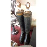 A pair of antique lady's black leather riding boots with wooden trees named to Dobbie