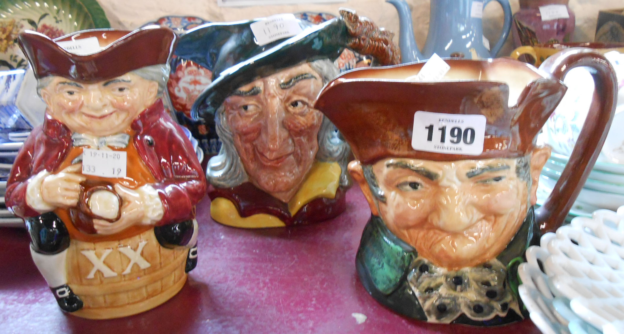 A Royal Doulton character jug D 6403 Pied Piper, Old Charlie similar, and a Royal Doulton Toby jug