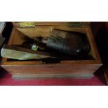 A wooden box of collectable items including Lesney milk cart, hip flask, spirit level, etc.