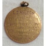 A First World War period 9ct. gold token commemorating the voluntary call up of L.E. Milton of
