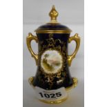 A Coalport miniature two handled urn decorated with a central panel depicting a lakeside scene on