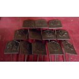 A set of twelve cast iron herb garden labels