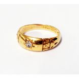 A hallmarked 18ct. gold gypsy set diamond ring