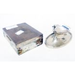 A silver oval capstan inkwell with glass liner and detached flip-top - sold with a silver