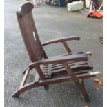 A teak steamer chair with cover