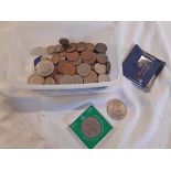 A box containing Great British and world coinage