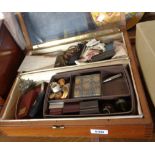 A table top display cabinet with various contents including musical lighter, marbles, etc.