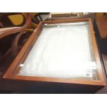 A pair of 61cm stained pine framed table top display cabinets with glazed lift tops