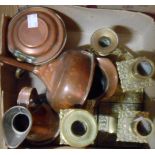 Four brass candlesticks, a copper jug, and other copper items