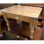 A 60cm modern polished pine tea table with moulded top, set on turned legs