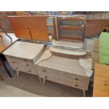 A mid 20th Century formica faced three piece bedroom suite, comprising a 91cm dressing chest with