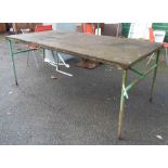 A large metal potting table