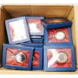 A collection of display cased reproduction pocket watches all with quartz movements