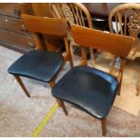 A set of four retro stained wood framed G-plan style dining chairs with wide curved back rails and