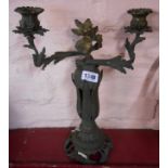 A Victorian ormolu twin branch candlestick in the Rococo style
