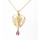An Edwardian design 9ct. gold seed pearl, peridot and amethyst drop pendant, on 9ct chain - boxed