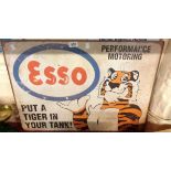A reproduction printed tin Esso sign