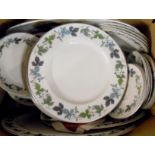 A Royal Doulton Burgundy pattern part tea and dinner service including bowls, cups and saucers,