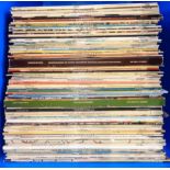 A box containing assorted vinyl LP records including Simon & Garfunkel, Elvis Presley, Classical,