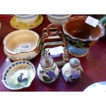 Six pieces of Torquay pottery including dog bowl, a Devon violet scent bottle and Kentish similar,