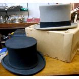 A boxed grey top hat - sold with a black collapsible top hat