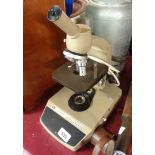 A Vicker's Instruments monocular microscope with illuminated base