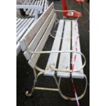 A 1.83m old painted cast iron framed garden bench with triple slatted back and seat