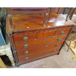 A 1.32m Regency mahogany chest with three short drawers, flanking acanthus reeded half columns and