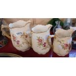 A set of three Victorian graduated jugs on ivory ground