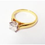 An import marked 750 gold diamond solitaire ring - 1ct.
