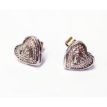 A pair of white metal heart shaped stud ear-rings with tiny diamond to centre and marked 9ct