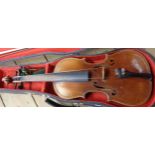 A late 19th - early 20th Century Joseph Guarnerius copy violin in hard case, and another similar -