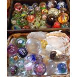 Two boxes containing a large quantity of paperweights