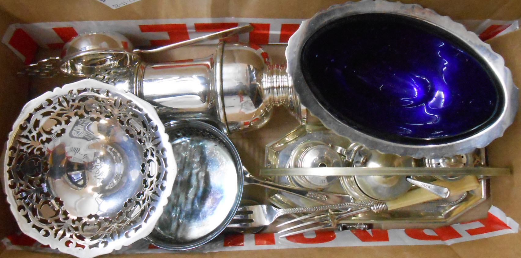 A box containing a quantity of small silver plated items including Regis sugar caster, large