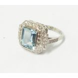 An Art Deco style marked PLAT ring, set with central 2.55ct oblong aquamarine within a stepped