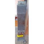 A 95cm high vintage Cannon painted metal tower gas heater with glazed panel door to front, set on