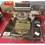 A vintage child's tin plate toy typewriter by Gebruder Schmidt