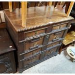 A 93cm antique oak chest in the Jacobean style with two shallow long drawers and two deeper