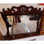 A Georgian style walnut veneered fretwork wall mirror with pierced decoration, gilt bird and