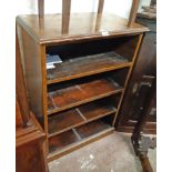 A 72cm old stained mixed wood four shelf open bookcase, set on plinth base