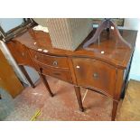 A 1.37m reproduction mahogany cross banded and strung serpentine front sideboard in the antique