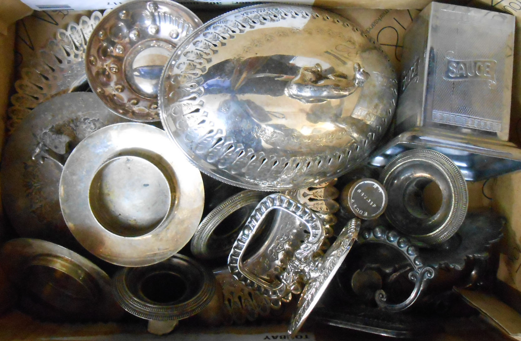 A box containing a quantity of small silver plated items including tureen handles, wine taster and