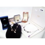 A small collection of boxed costume jewellery pendant necklaces including Swarovski heart, etc.